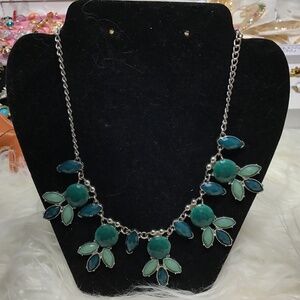 Silver necklace with green flowers